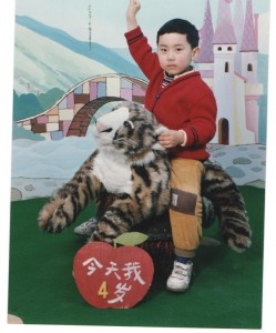 Kid on tiger