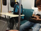 Studying In The Subway, On A Portable Desk