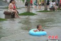 A Makeshift Swimming Pool In Wuhan Brings Out The Young And Old