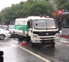 A Beijing Street-Cleaning Truck Decided To Clean The Streets With Water While It Was Raining