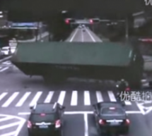 Chinese Motorcyclist Narrowly Avoids Being Crushed Under Overturning Truck