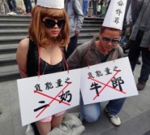 Dunce-Capped Mistress And Cowherd Kneel In Shenzhen To Protest Official Corruption