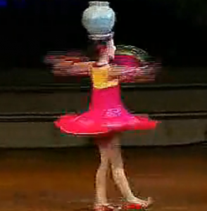 North Korea girl spins vase on head featured image