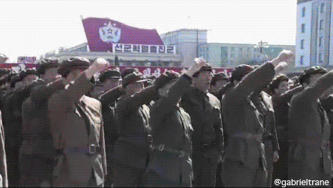 North Korean soldiers pump fist in Kim Il-sung square in Pyongyang