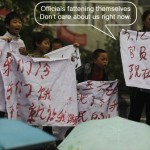 Sichuan earthquake victims hold banner saying officials don't care
