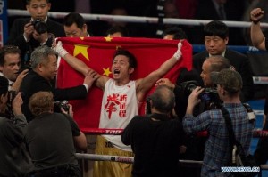 Zou Shiming wins pro boxing debut in Macau