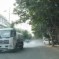 Driver Speeds Up To Shield Old Woman From Water Truck