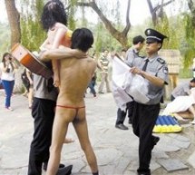 Here’s Two Men In Thongs With Blow-Up Dolls At Peking University