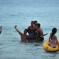 Posing With An Injured Dolphin Doesn’t Make You Cool, Guys [UPDATE]