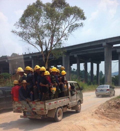 Many migrant workers in a truck