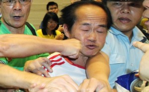 Protester in Hong Kong punched