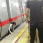 Woman Jumps In Front Of Train At Guomao Subway Station, Emerges Unscathed