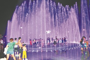 Boy lifted into air by water fountain