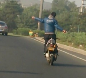 Man on motorcycle without arms