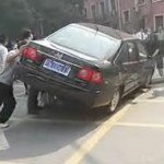 Pushing car up to rescue person run over
