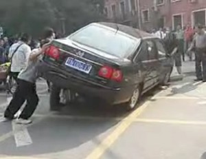 Pushing car up to rescue person run over