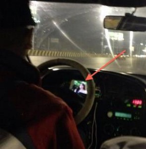 Cabbie watches TV while driving