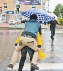 Woman in heels carries boyfriend