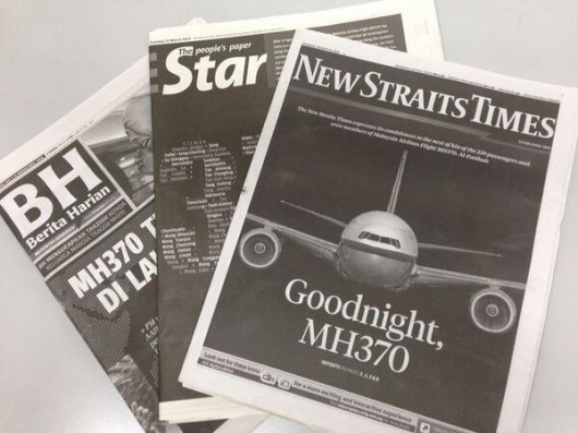 MH370 headlines in black and white