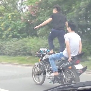 Man surfs motorcycle