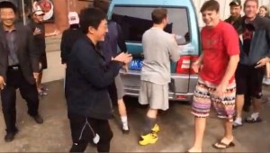 Ultimate Frisbee players help move van