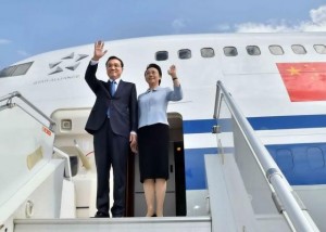 Chinese Premier Li Keqiang and his wife Cheng Hong wave as they arrive at the airport in Addis Ababa