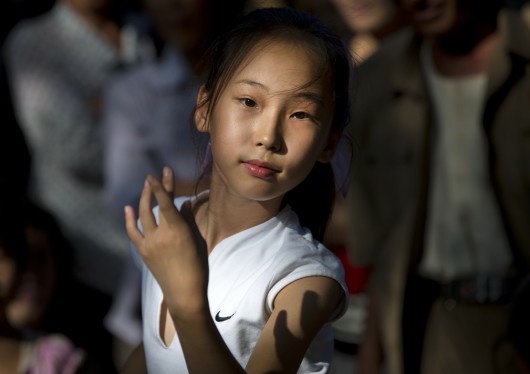 North Korean Girl Dancing On National Day, Pyongyang, North Korea